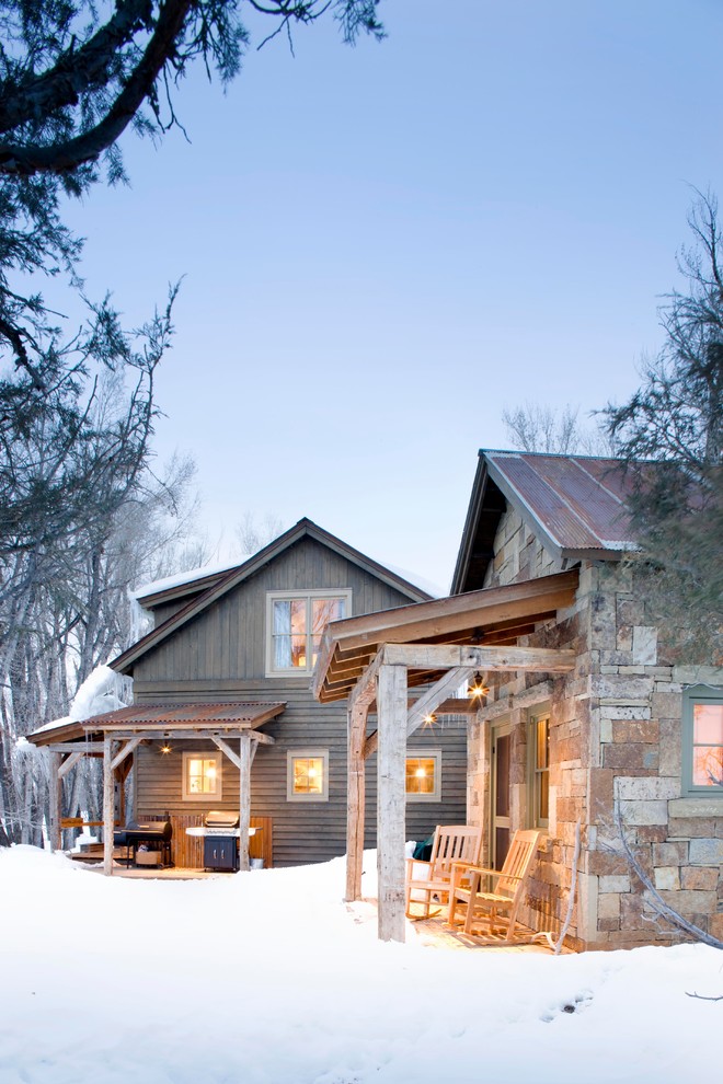 Inspiration for a rustic wood exterior home remodel in Denver
