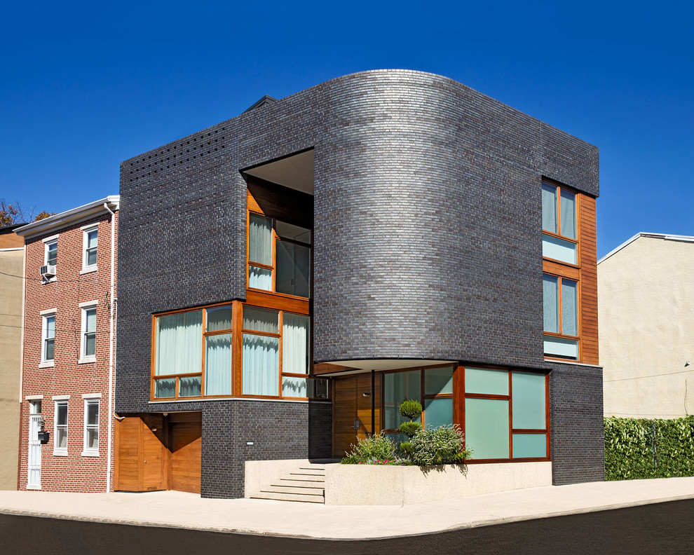 Example of a trendy wood exterior home design in Philadelphia