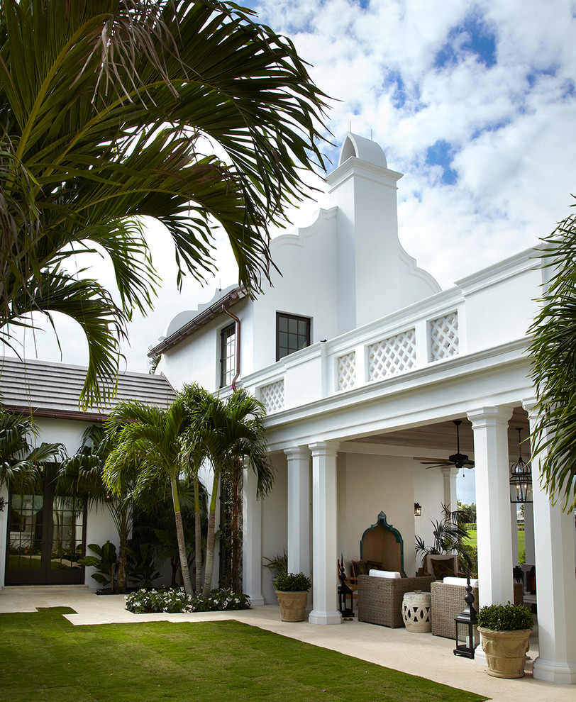 Inspiration for a white mediterranean two floor house exterior in Miami.