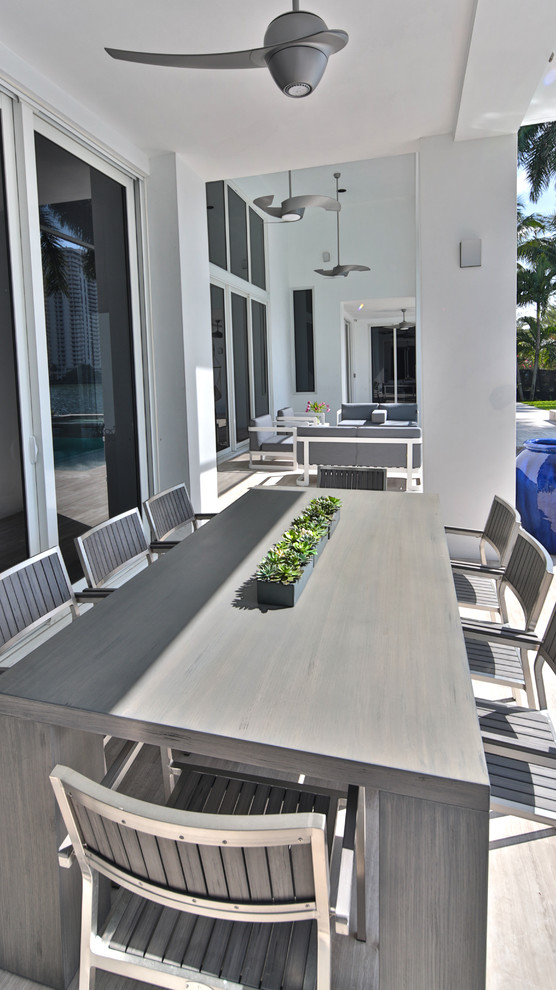 This is an example of a large and white contemporary bungalow house exterior in Miami.