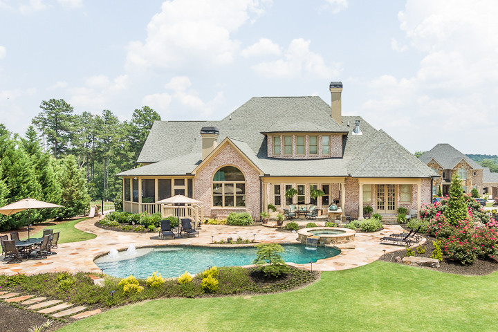 Large traditional beige two-story mixed siding exterior home idea in Atlanta with a clipped gable roof