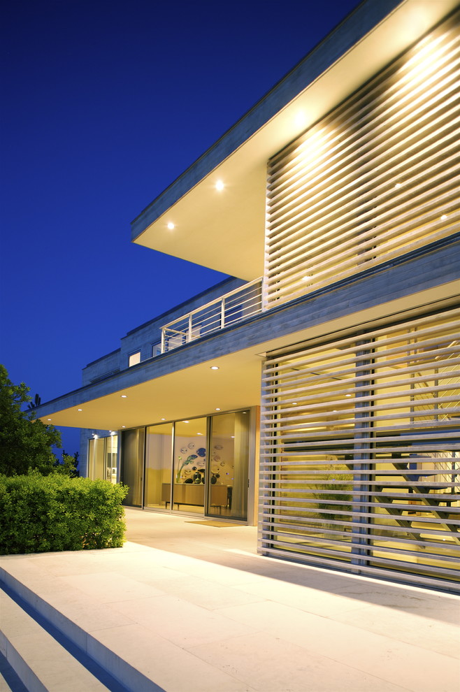 Example of a minimalist glass exterior home design in New York