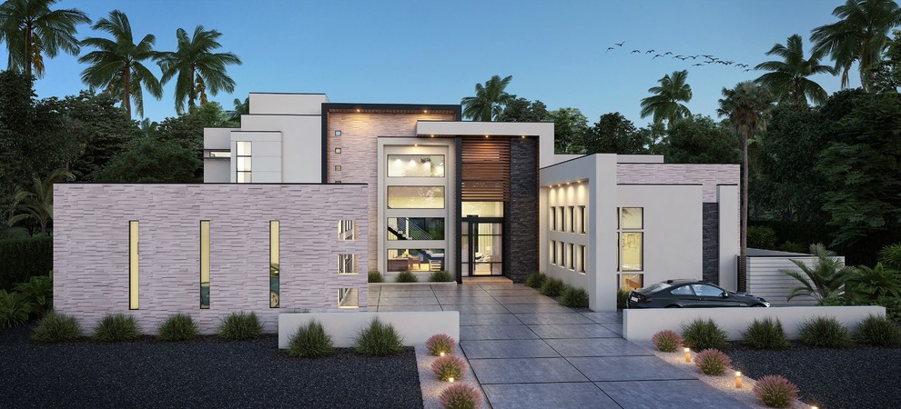 Réalisation d'une grande façade de maison métallique et blanche minimaliste à un étage avec un toit plat.