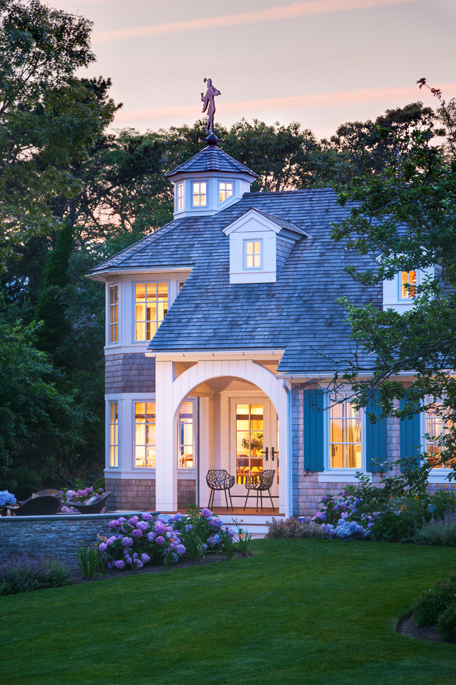 Large traditional brown two-story wood house exterior idea in Boston with a hip roof and a shingle roof
