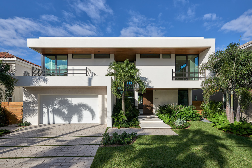 Design ideas for a white contemporary two floor detached house in Miami with a flat roof.