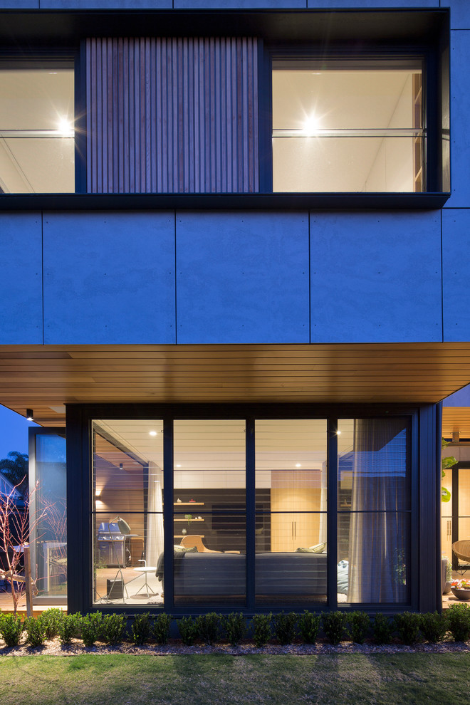 Mittelgroßes, Zweistöckiges Modernes Einfamilienhaus mit Betonfassade und Blechdach in Sydney