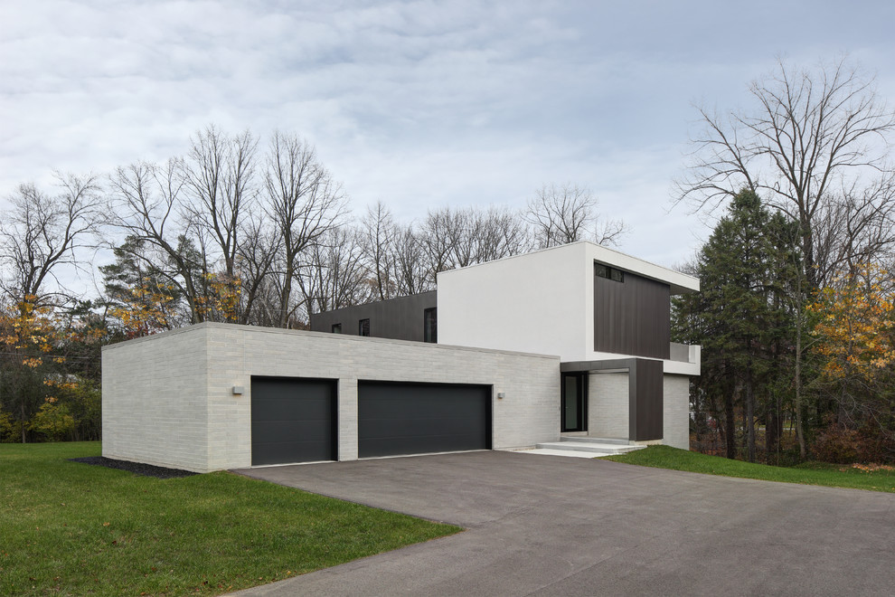 Design ideas for a modern house exterior in Milwaukee.