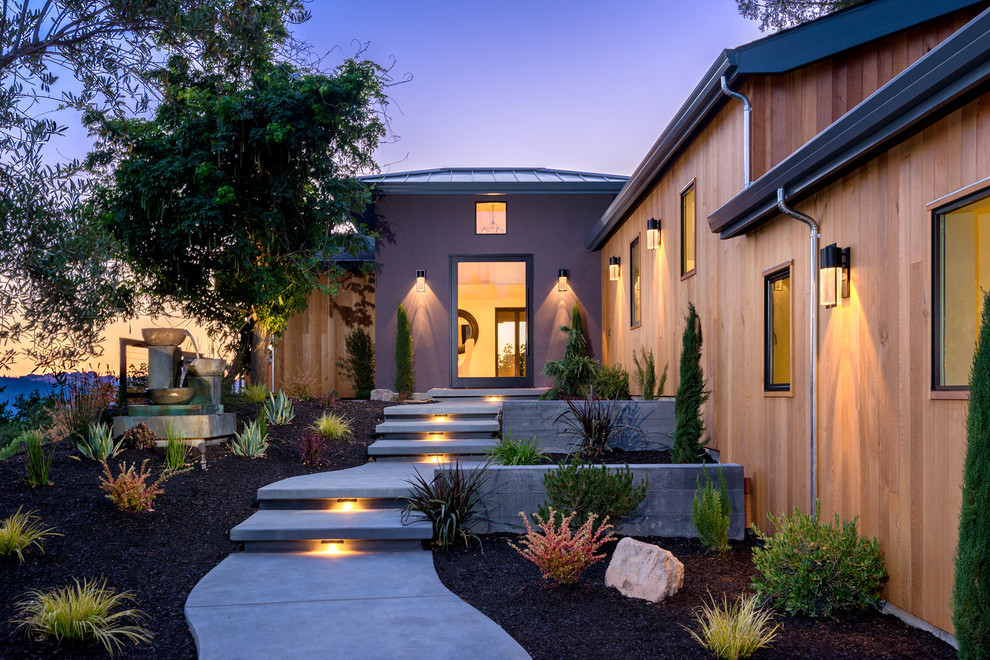 Mid-sized modern multicolored one-story mixed siding house exterior idea in San Francisco with a hip roof and a metal roof