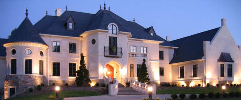 Inspiration for a huge timeless gray three-story stucco exterior home remodel in Philadelphia