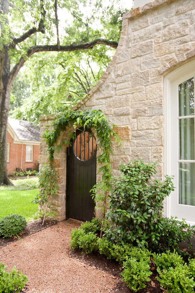 Traditional stone exterior home idea in Houston