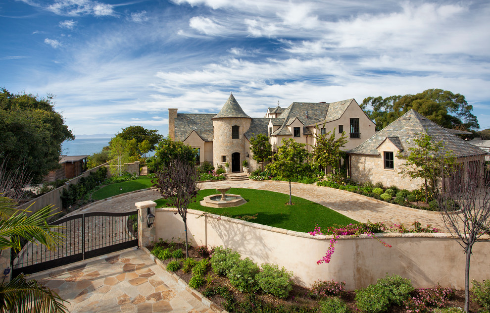 Beige two floor house exterior in Santa Barbara with stone cladding.