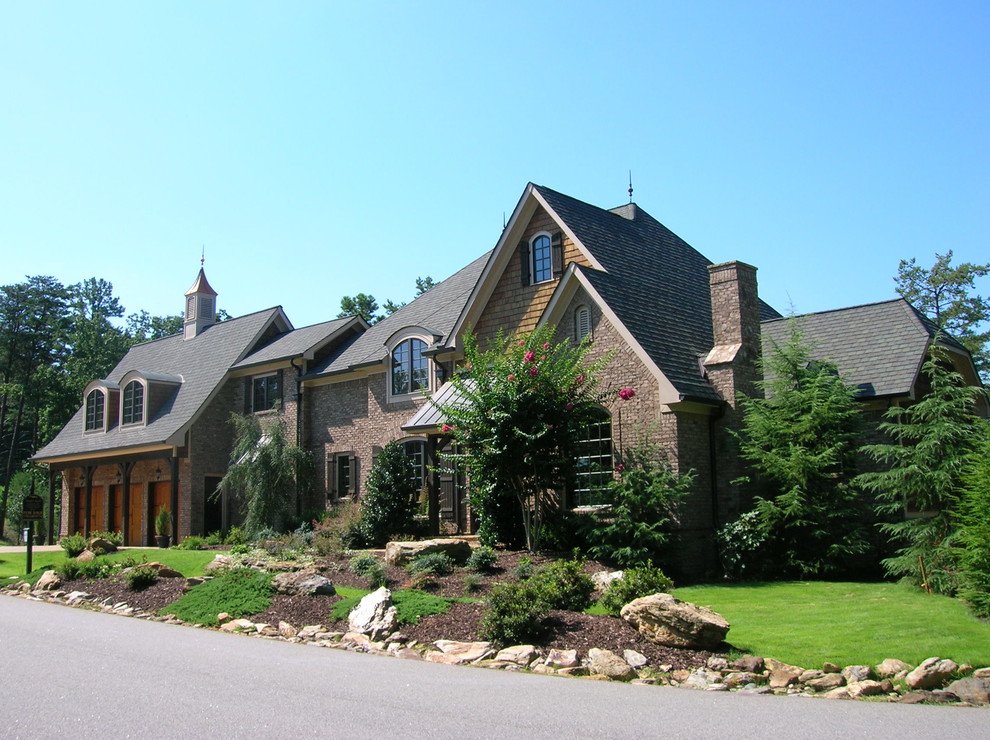 Inspiration for a large timeless two-story mixed siding house exterior remodel in Atlanta with a shingle roof
