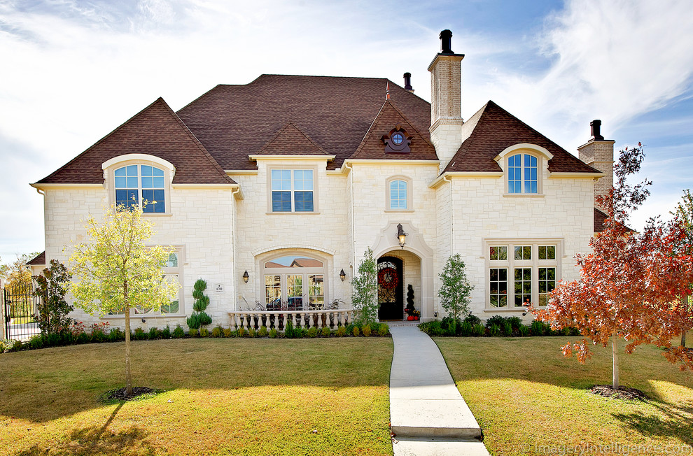 Photo of a large and white traditional two floor detached house in Dallas with stone cladding, a hip roof and a shingle roof.