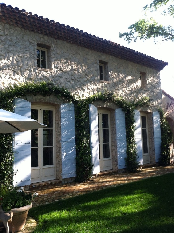 Example of a farmhouse exterior home design in Sacramento