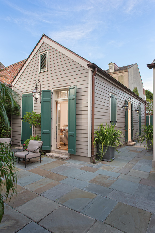 Design ideas for a traditional house exterior in New Orleans with wood cladding.