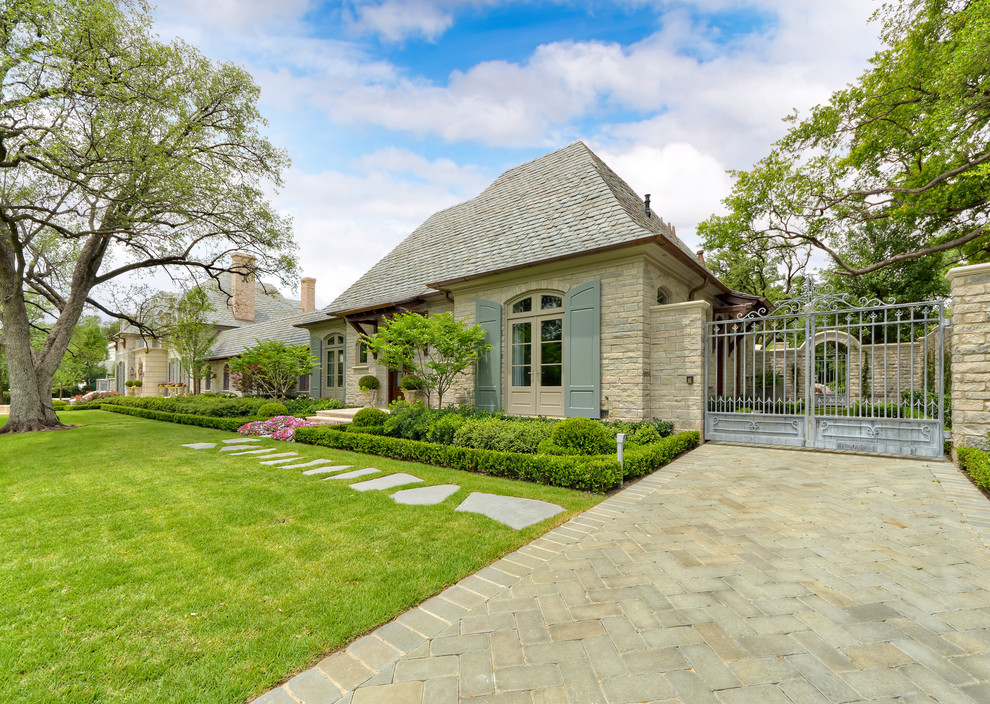 Inspiration for a timeless brick exterior home remodel in Dallas