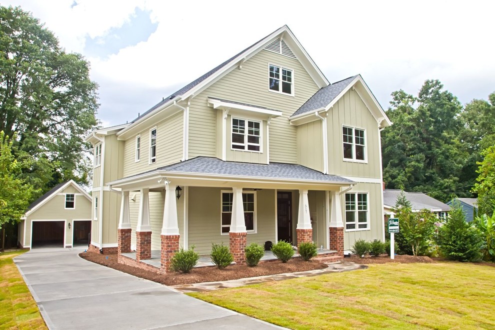 Inspiration for a large craftsman beige two-story concrete fiberboard gable roof remodel in Raleigh