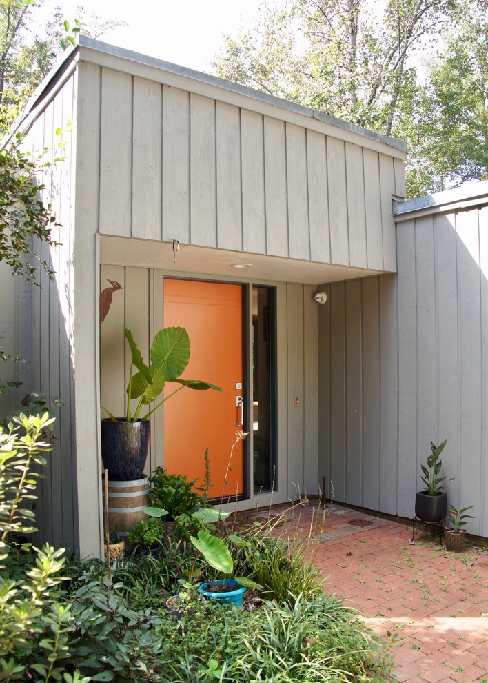 Inspiration for a contemporary gray two-story wood exterior home remodel in Raleigh with a metal roof