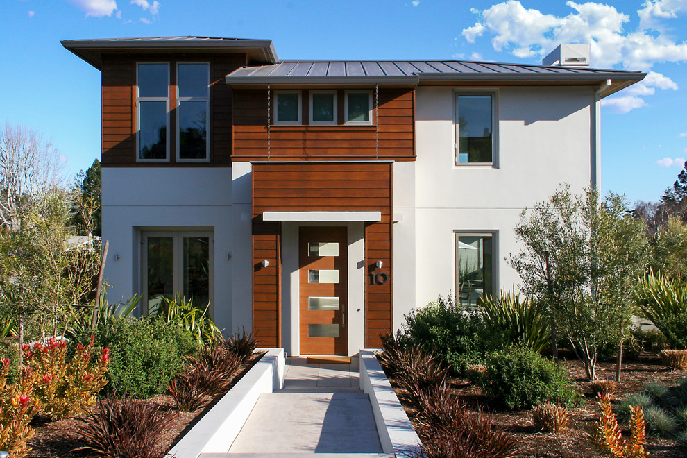 Photo of a medium sized and white contemporary two floor house exterior in San Francisco with mixed cladding.
