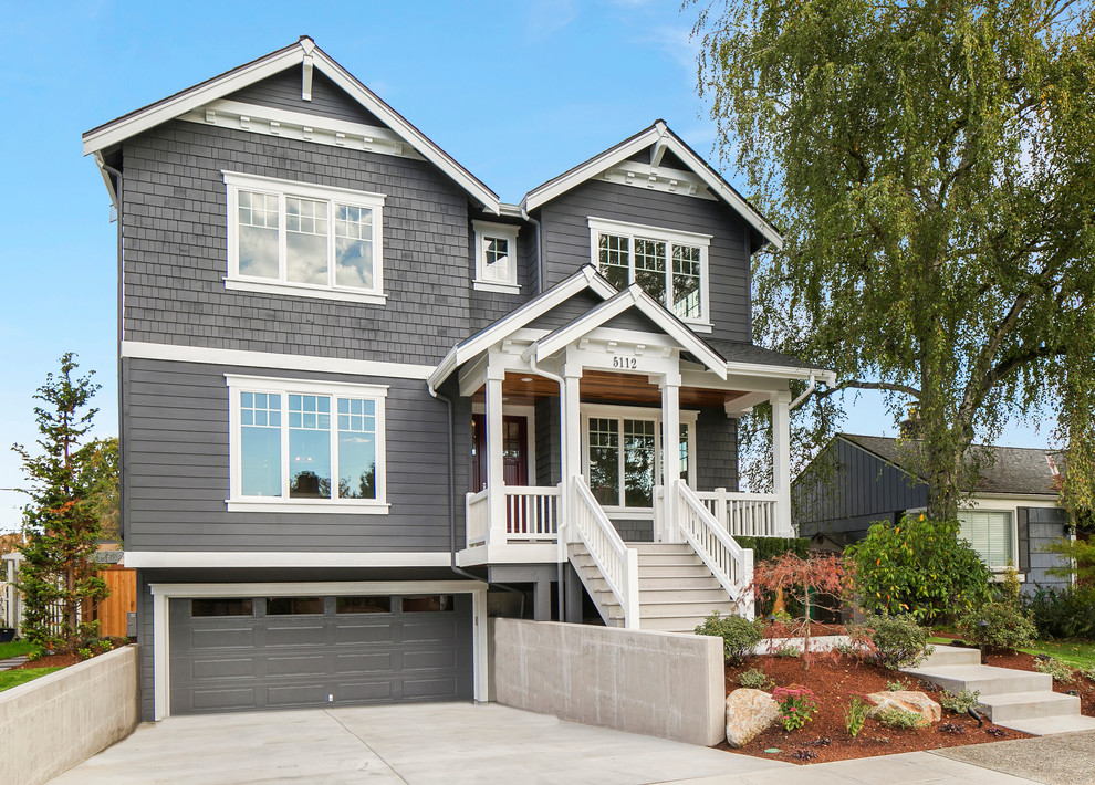 Craftsman gray three-story wood gable roof idea in Seattle