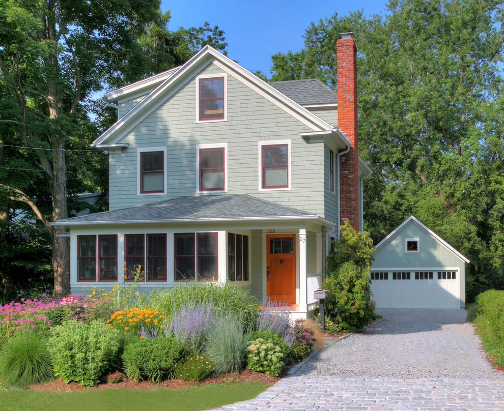 Mid-sized elegant green three-story wood exterior home photo in Bridgeport