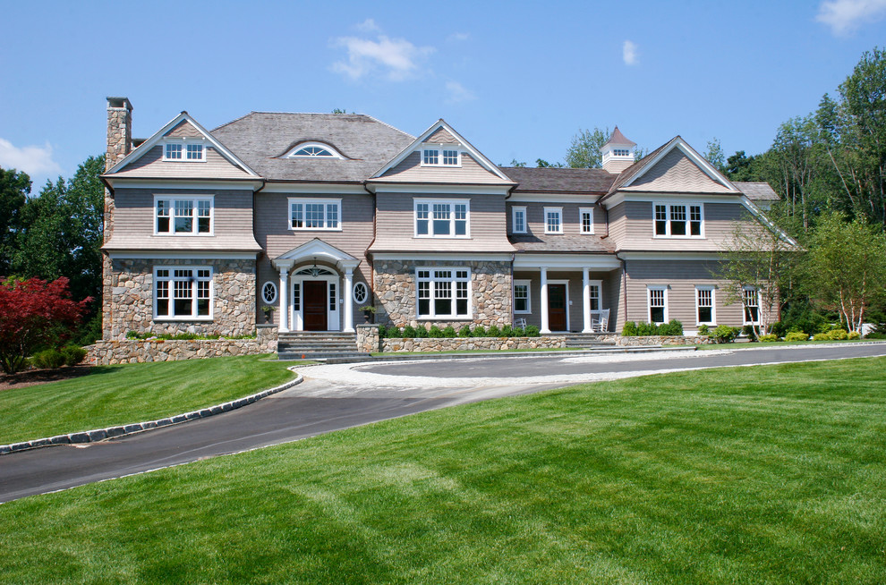 Large traditional gray three-story mixed siding exterior home idea in New York with a hip roof