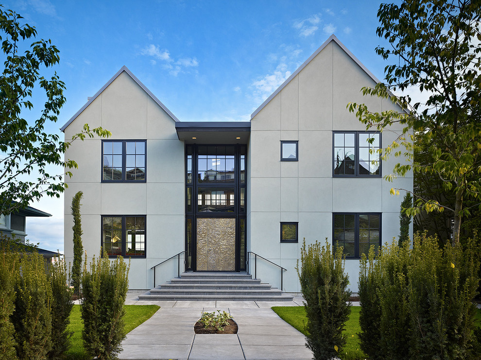 Example of a large transitional two-story exterior home design in Seattle