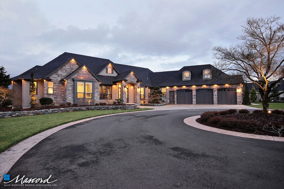 Huge trendy beige one-story stone exterior home photo in Portland with a hip roof