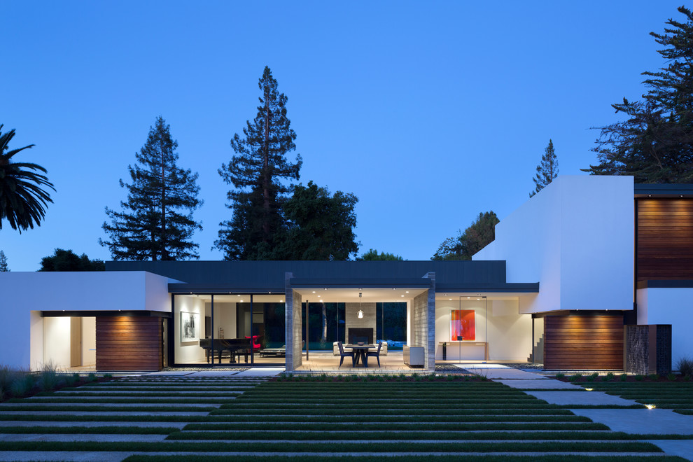 Example of a minimalist two-story glass exterior home design in San Francisco