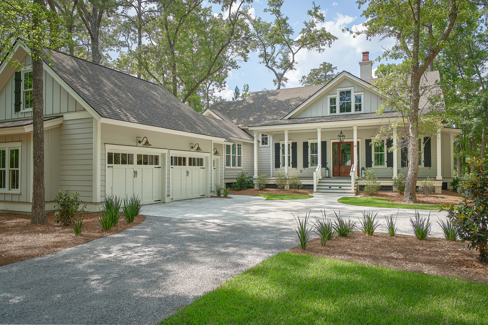 Large beach style gray two-story wood house exterior photo in Charleston with a shingle roof