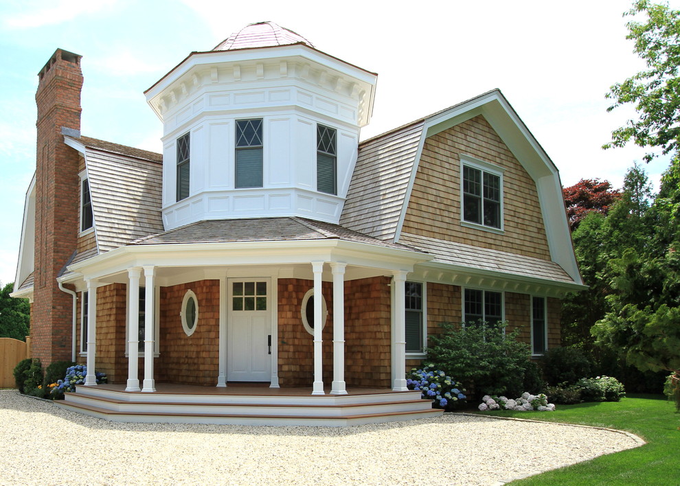 Large coastal brown two-story wood house exterior idea in New York with a shingle roof