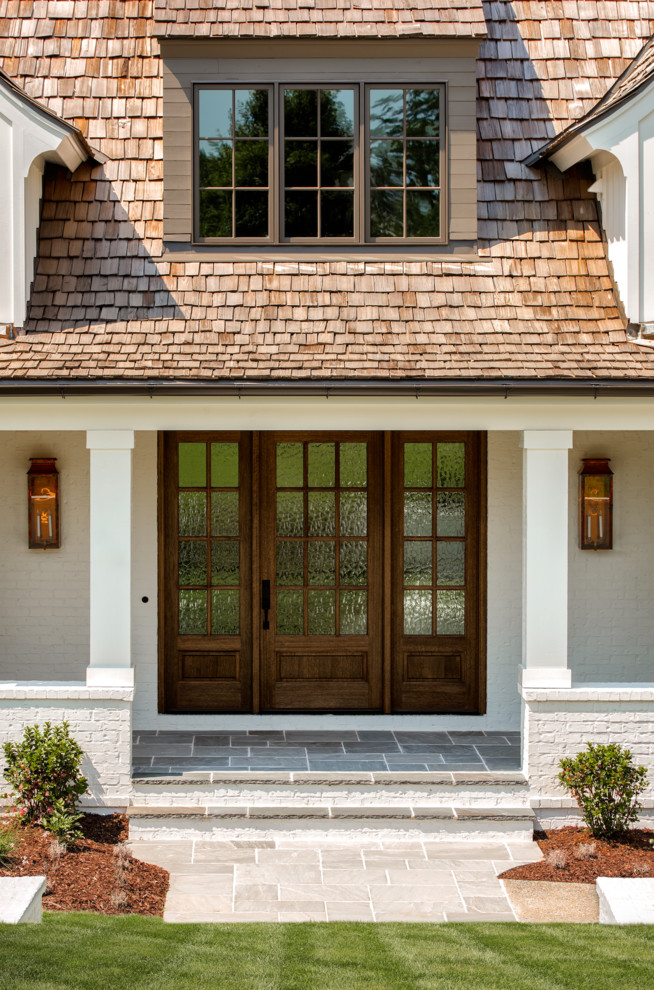 Inspiration for a farmhouse house exterior in Charlotte.