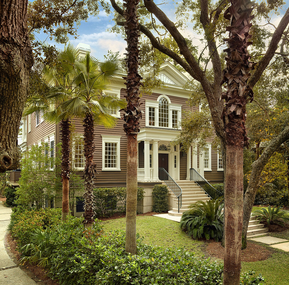 Photo of a classic house exterior in Charleston with wood cladding.