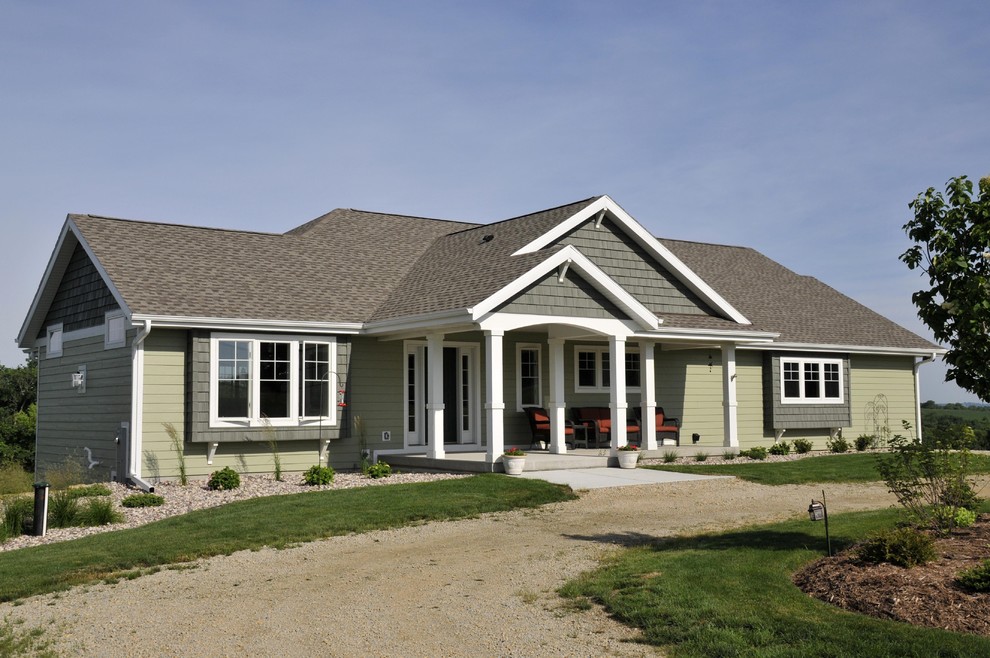 Example of a green two-story concrete fiberboard exterior home design in Other