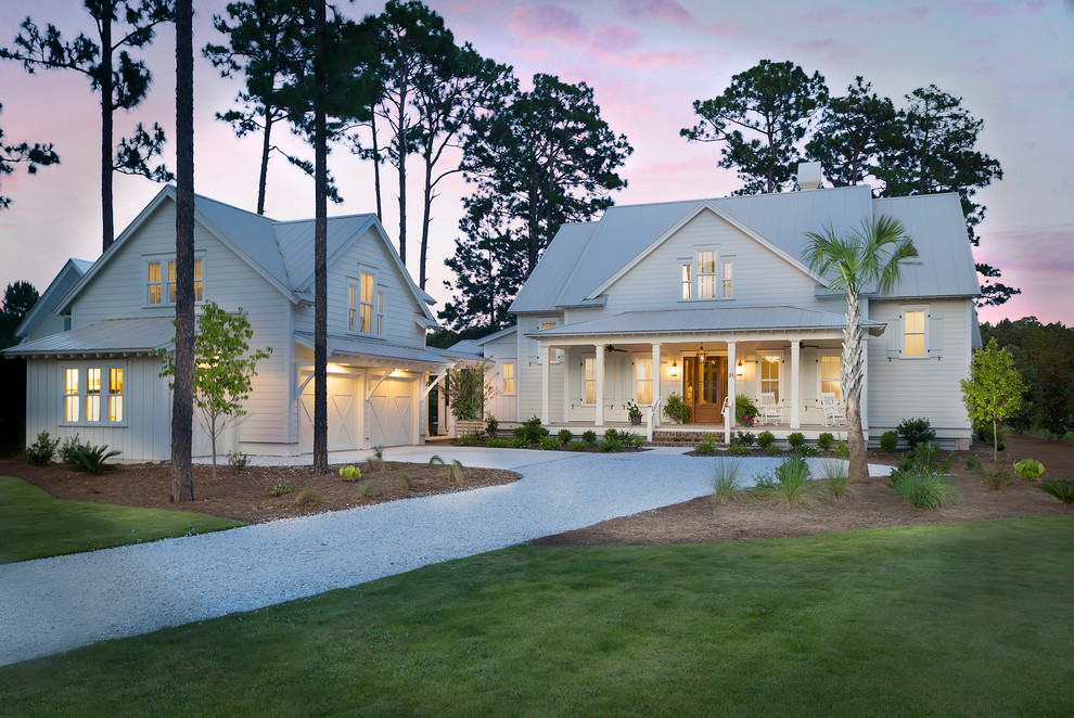 Large transitional white two-story wood gable roof idea in Charleston