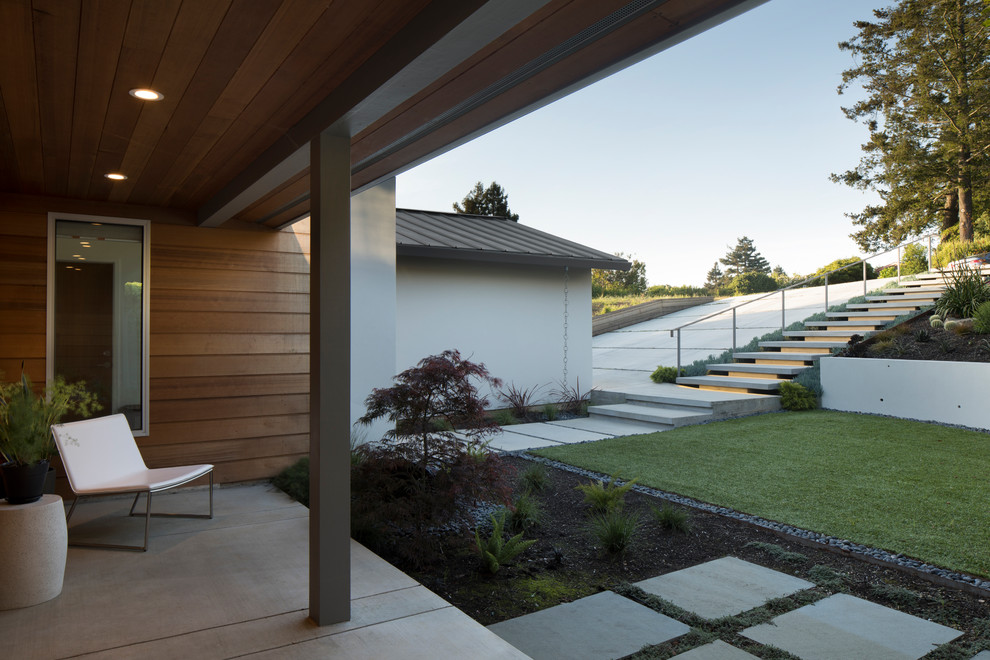 Inspiration for a mid-sized contemporary white one-story wood exterior home remodel in San Francisco with a metal roof