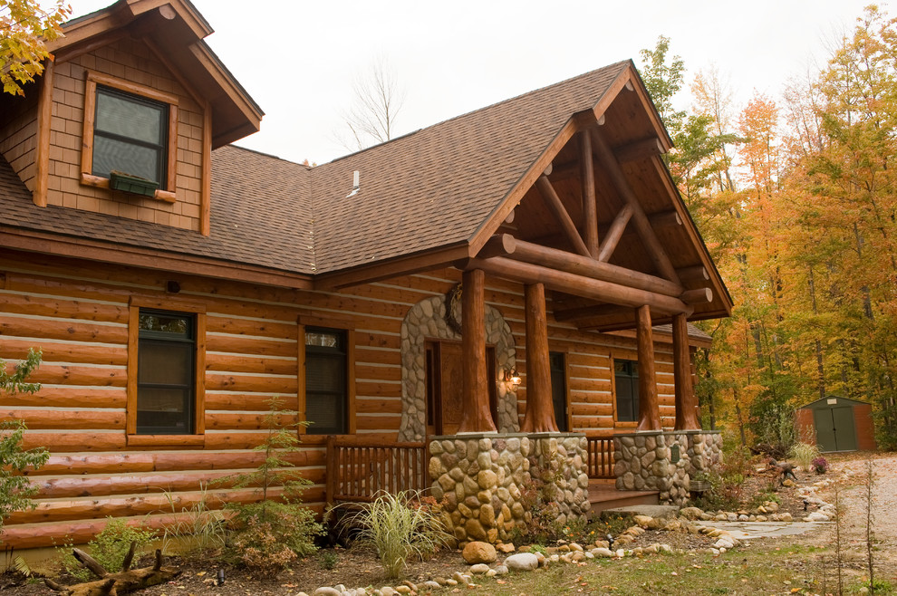 Full cedar log front entrance Rustic Exterior Other by