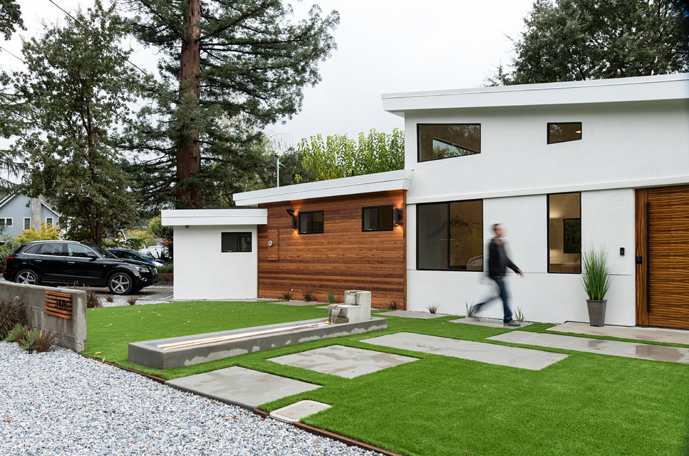 Inspiration for a white modern bungalow house exterior in San Francisco with a flat roof.