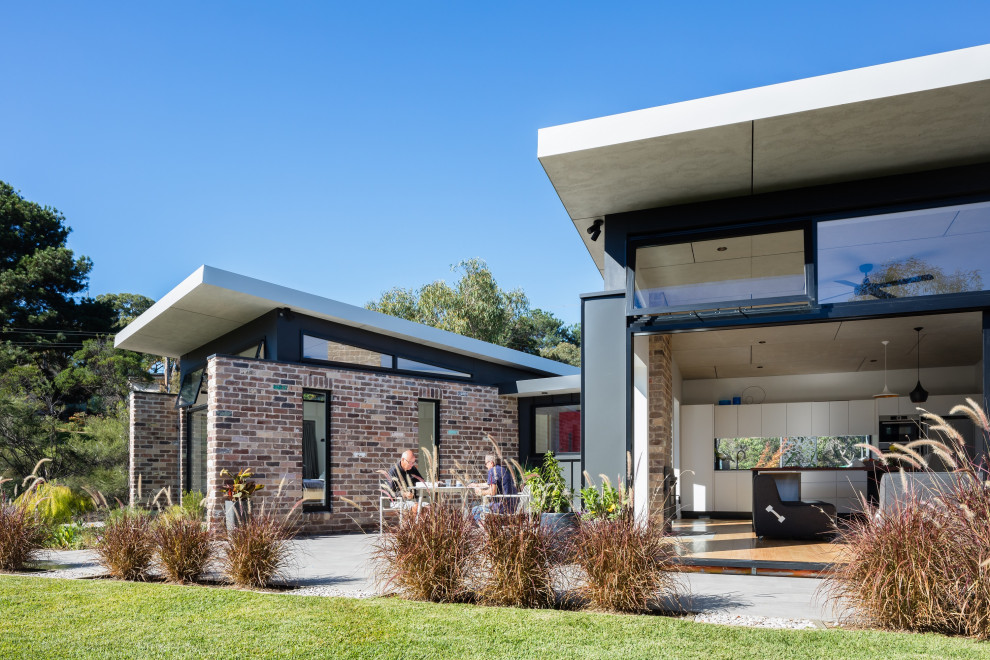 Design ideas for a contemporary brick detached house in Sydney.