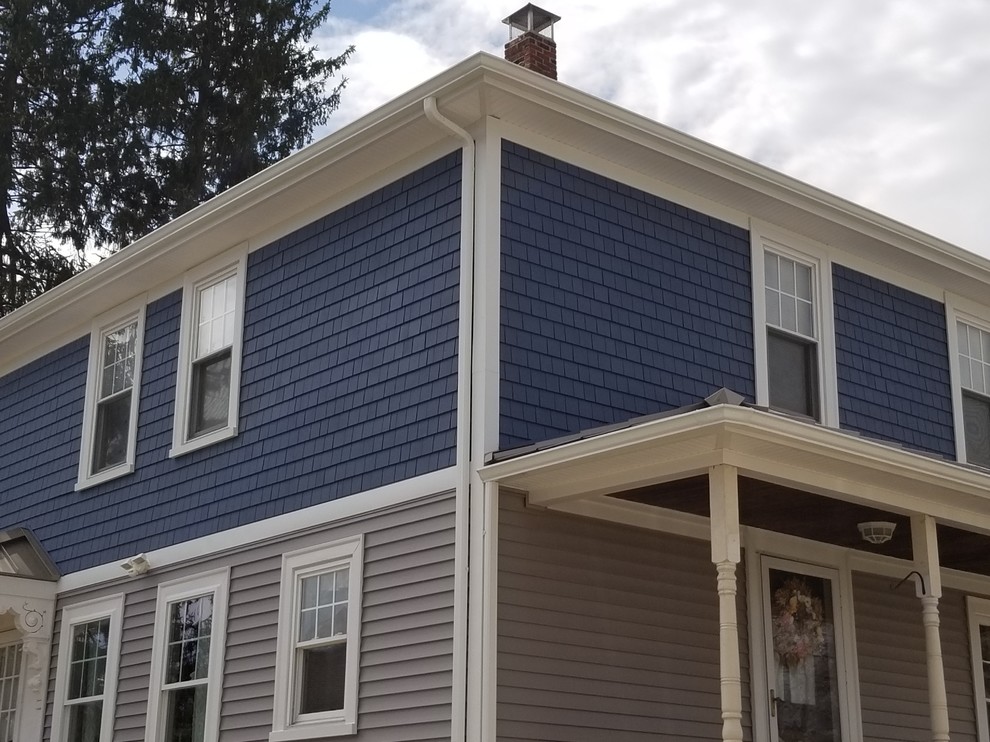 Inspiration for a medium sized and multi-coloured traditional two floor detached house in Providence with vinyl cladding, a hip roof and a shingle roof.