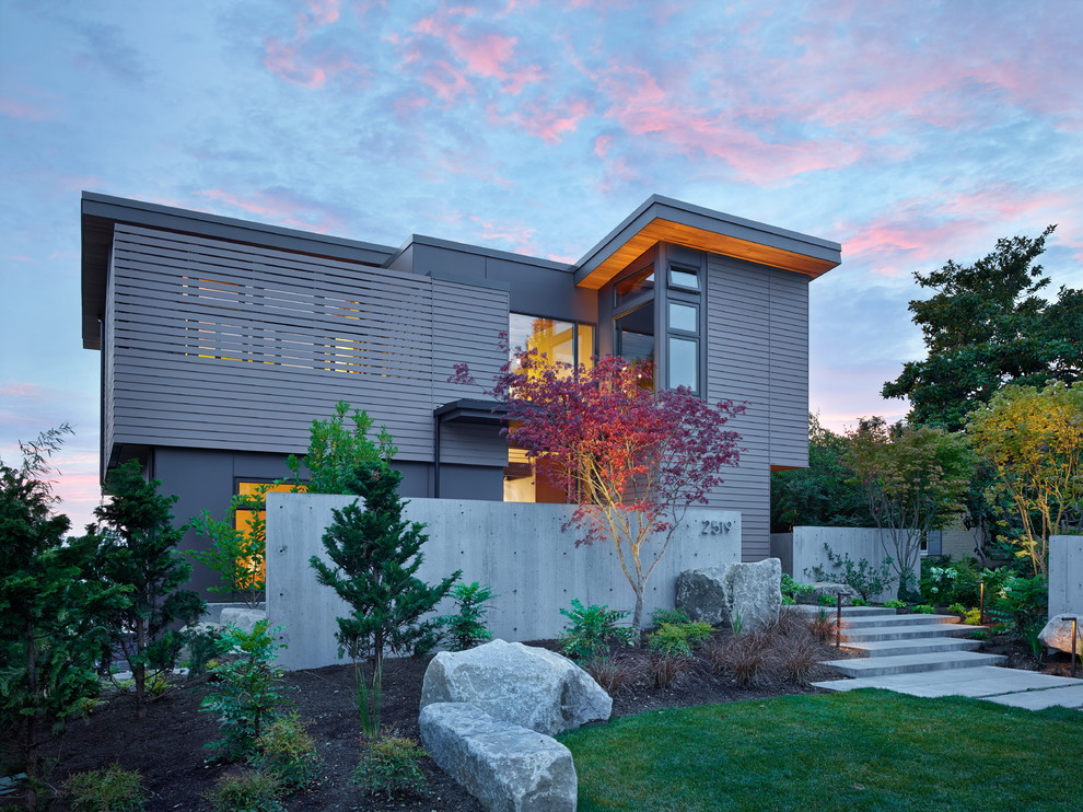 Design ideas for a gey contemporary two floor house exterior in Seattle with a flat roof.