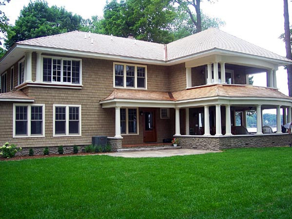 Design ideas for a beige classic two floor house exterior in Other.
