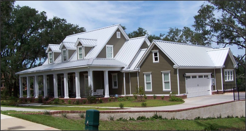 Example of a large arts and crafts gray two-story wood gable roof design in Atlanta