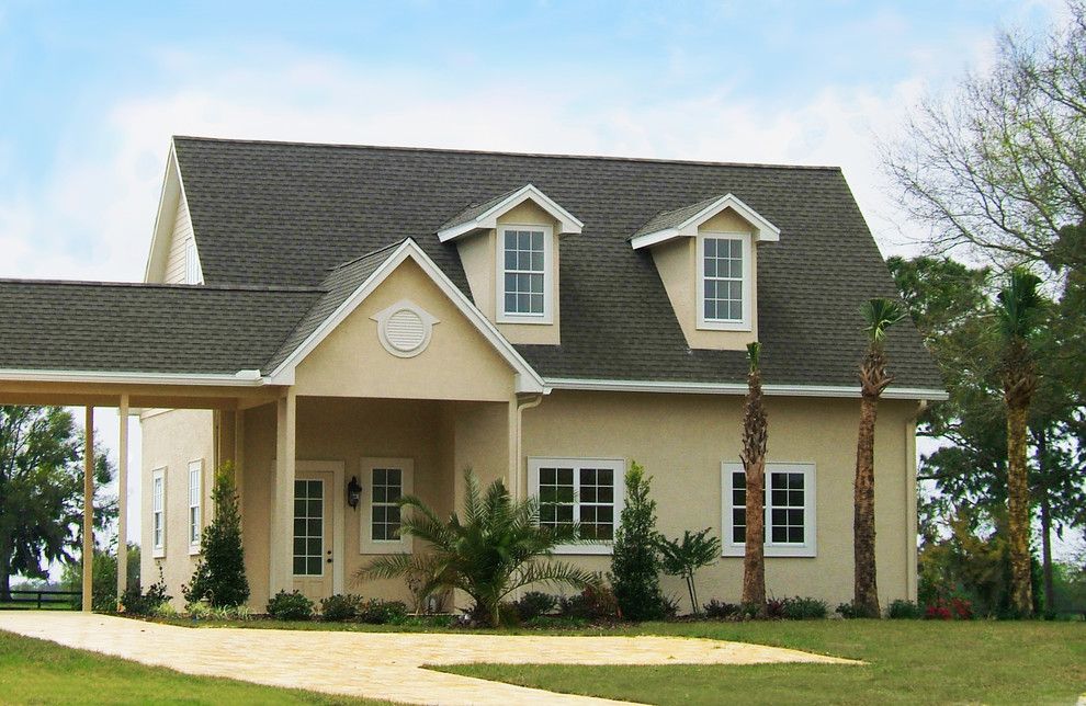 Small traditional two floor render house exterior in Orlando.