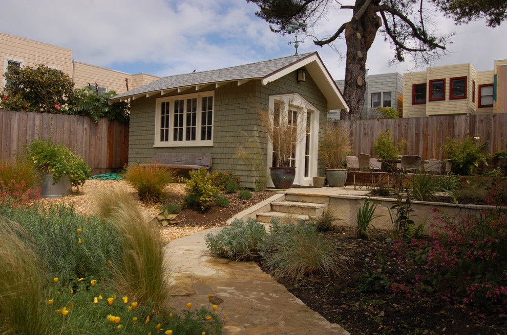Small classic bungalow house exterior in San Francisco with wood cladding.