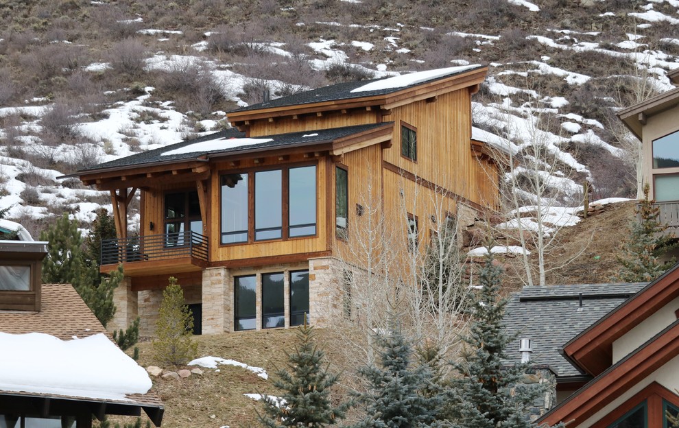 Small contemporary three-story wood exterior home idea in Denver