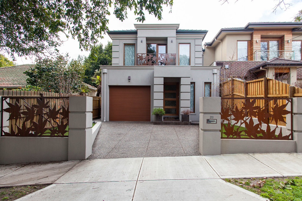 Großes Modernes Haus mit Metallfassade und beiger Fassadenfarbe in Melbourne