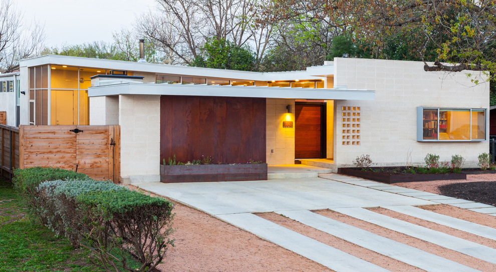 Inspiration for a mid-century modern exterior home remodel in Austin