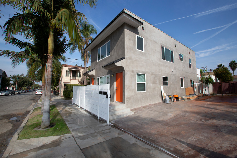 This is an example of a large and gey contemporary two floor render semi-detached house in Los Angeles.