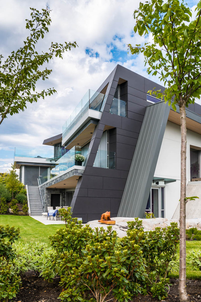 Photo of a contemporary house exterior in Vancouver with three floors.